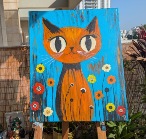 חתול בין הפרחים